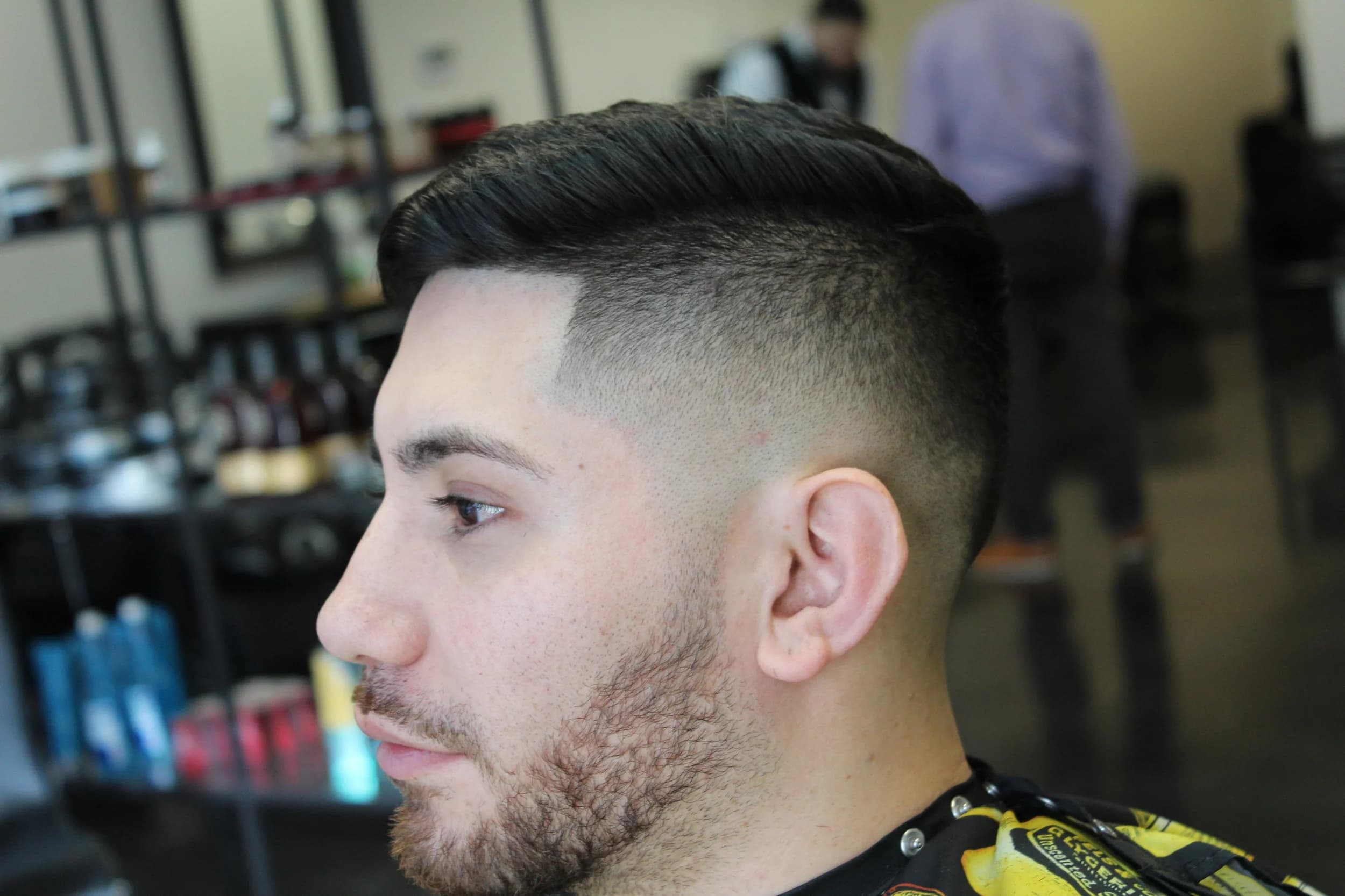 Professional side fade with clean execution - Professional barbering work by Isaiah Barber