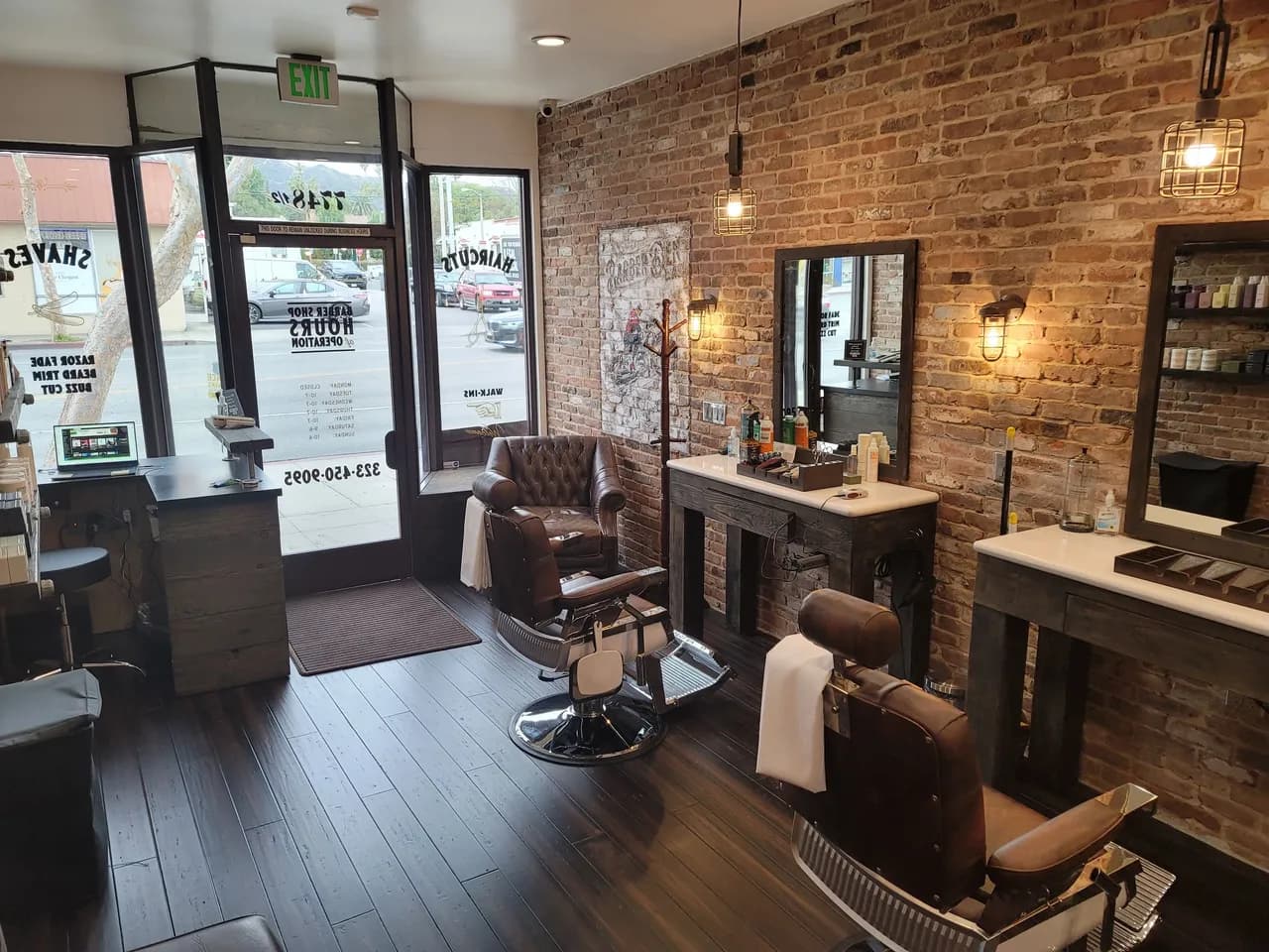 Modern barbershop interior with vintage barber chairs, mirrors, and warm lighting