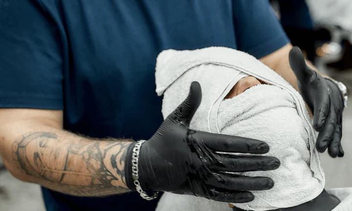 Traditional Hot Towel Shave service at Isaiah Barber - Luxurious traditional shave experience with hot towels, premium shaving cream, and expert technique for the smoothest finish.